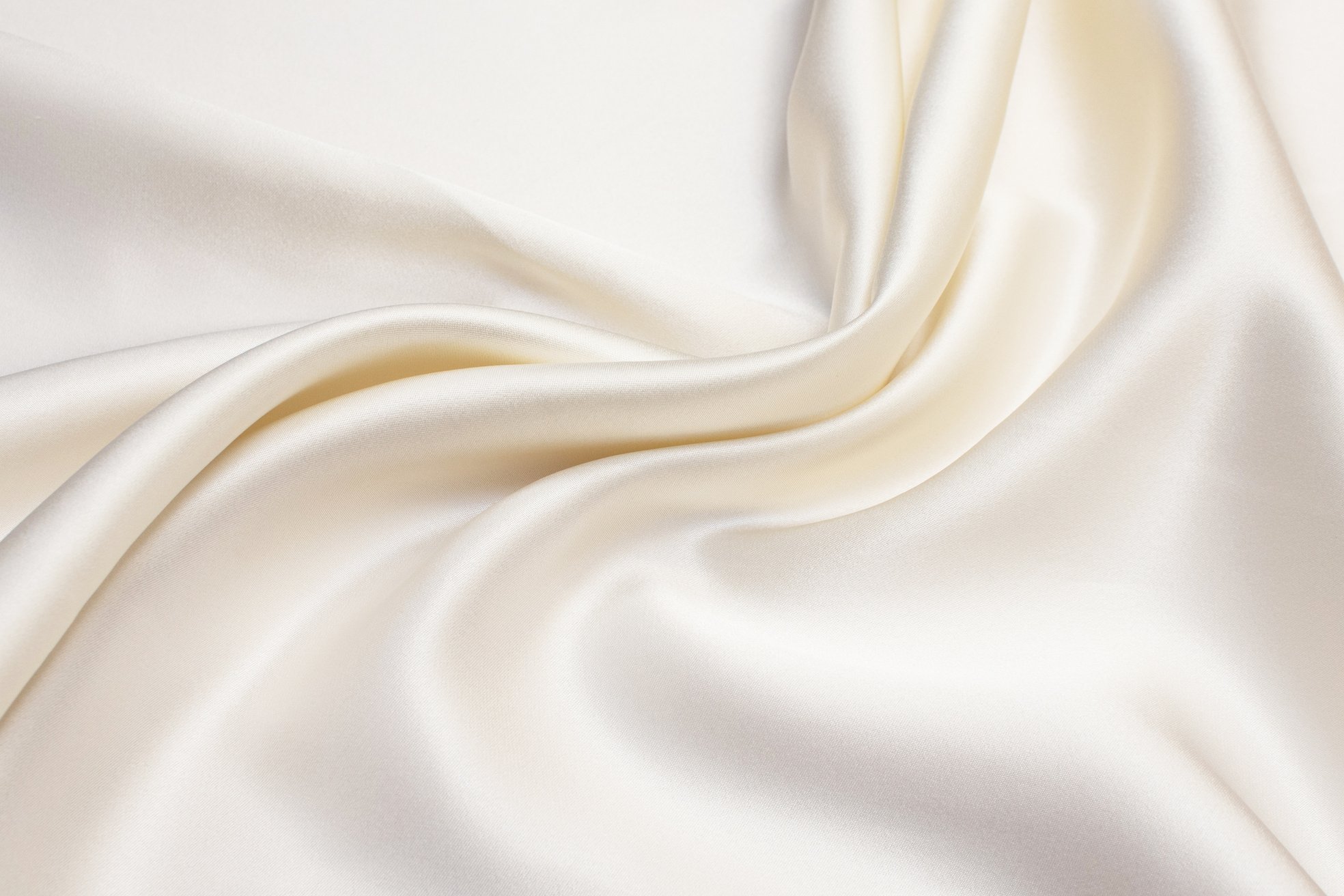 Texture of ivory silk fabric. Background, pattern.